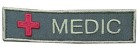 "Medic" merke brodert grønt
